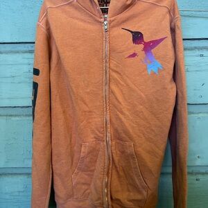 Free city Orange Zip-Up Hoodie with Bird Graphic